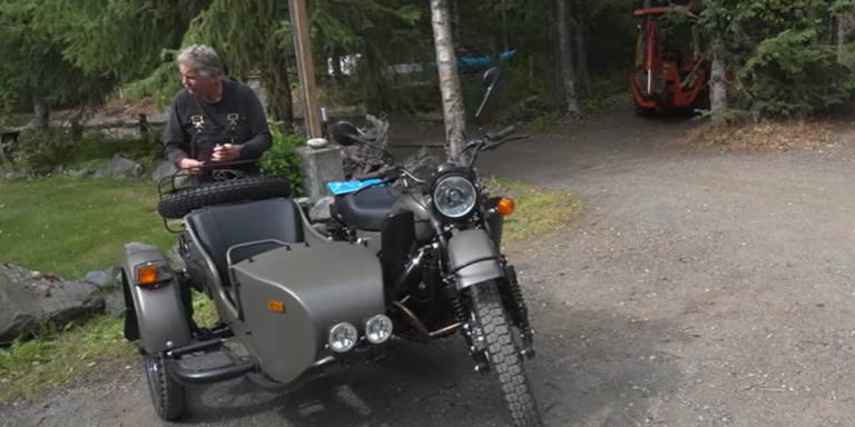 Putin gives a motorcycle to an alaskan man, who is