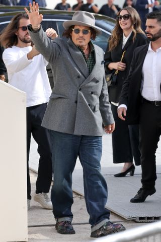 Johnny Depp appears casually in jeans at Dior event for his first Paris Fashion Week in over 30 years. Johnny depp appears casually in jeans at dior event for