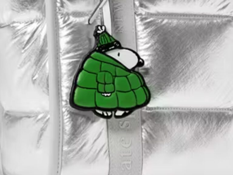 Kate Spade Outlet offers a Snoopy bag charm featuring a puffer coat for $68. Kate spade outlet offers a snoopy bag charm featuring a