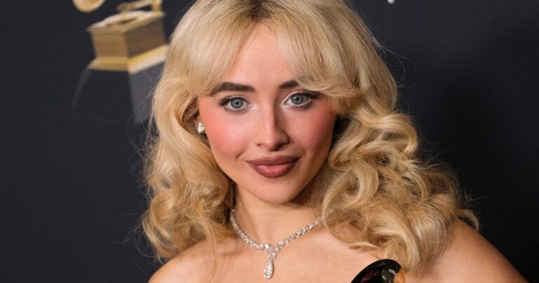 Sabrina Carpenter’s outfit featured a crop top and micro shorts. Sabrina carpenter's outfit featured a crop top and micro shorts.